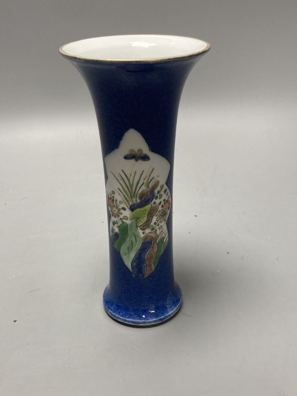 A Chinese powder blue ground vase and a similar cloisonne bottle vase, height 15cm